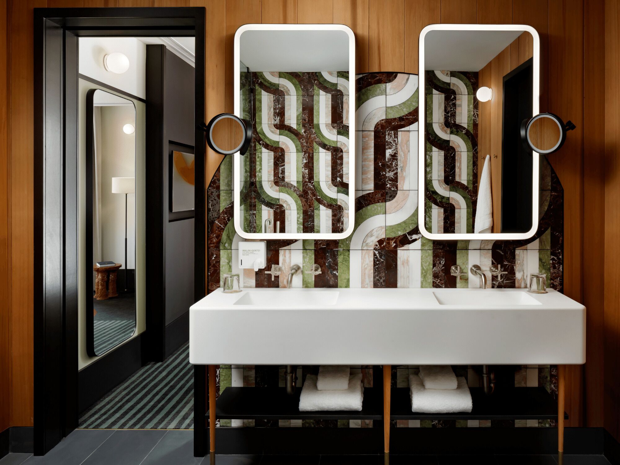 signature suite | bathroom | designer toiletries, hair dryer, bathrobes, slippers