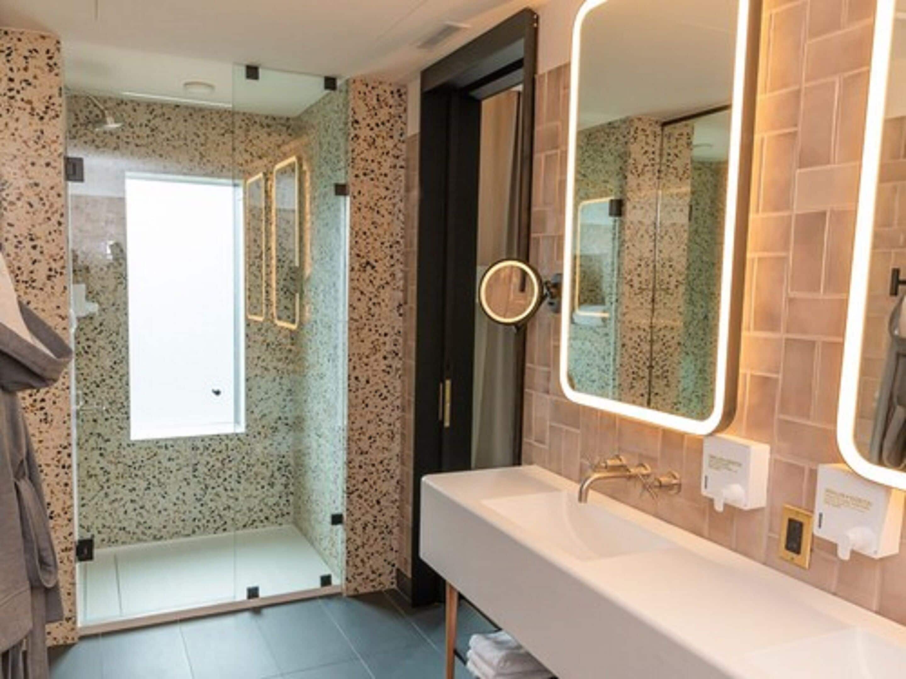 designer toiletries, hair dryer, bathrobes, slippers