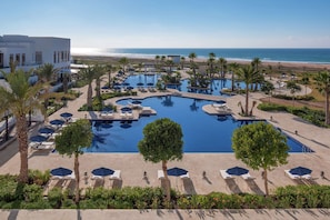 Outdoor pool, pool umbrellas, sun loungers