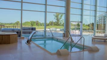 Indoor pool, seasonal outdoor pool, open 10 AM to 8 PM, pool umbrellas