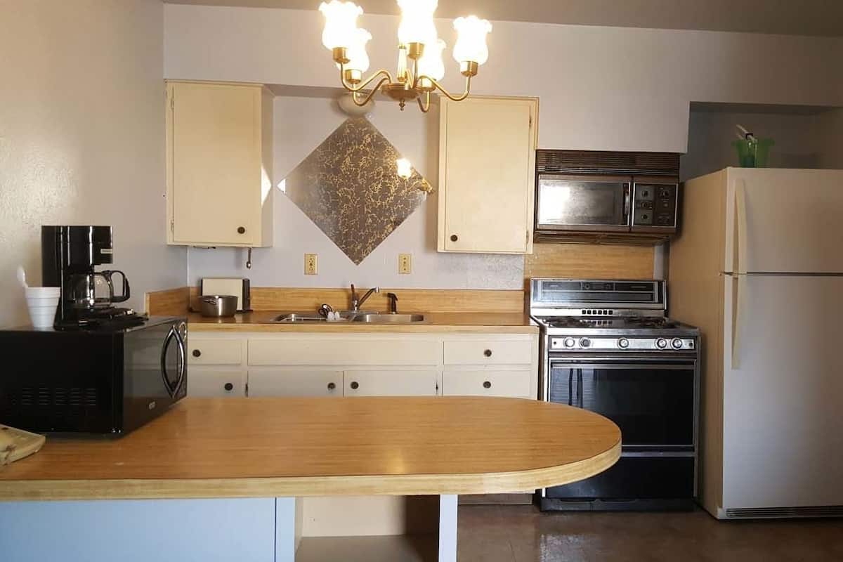 Premium Studio Suite, 1 Bedroom | Desk, blackout drapes, iron/ironing board, WiFi (free)