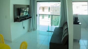 Apartment, 2 Bedrooms | Living room | Flat-screen TV