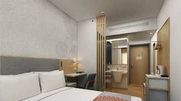 A modern hotel room with a large bed, a desk, a chair, a bathroom with a mirror and sink, and a wardrobe.