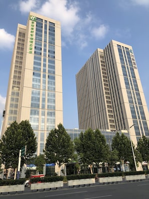Two high-rise buildings with modern architecture, featuring large windows and a clean, contemporary design. - Holiday Inn Express Hefei High Tech by IHG (Hefei)