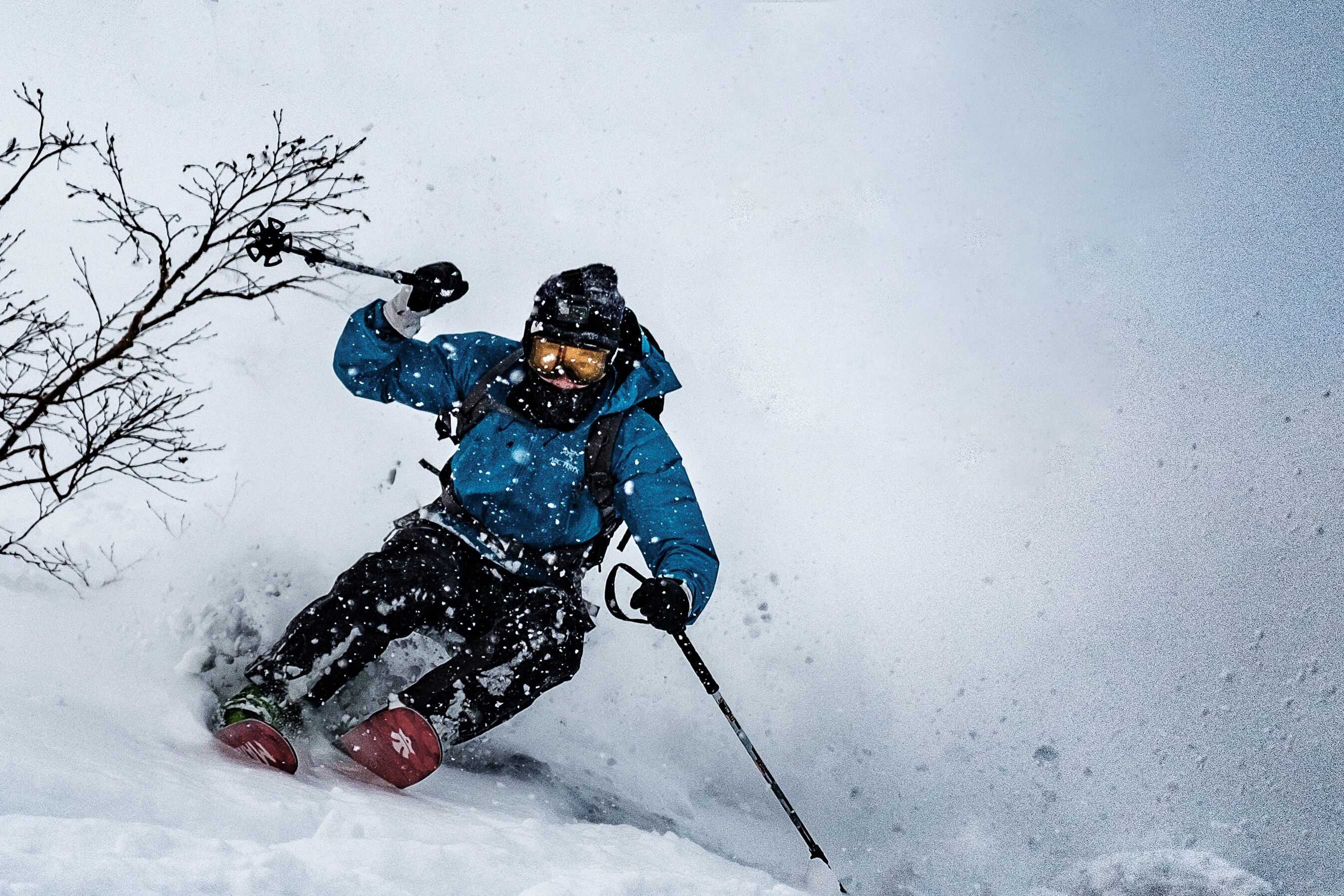 A person skiing down a snowy slope.