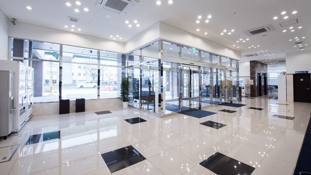 A modern lobby with glass doors, a reception desk, and a clean, tiled floor. - Toyoko Inn Nagoya Meieki Minami (Nagoya)