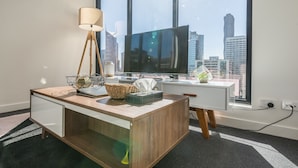 Basic Apartment, 2 Bedrooms, City View | Living area | Flat-screen TV - APC on Bourke (Melbourne)
