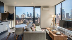 Basic Apartment, 2 Bedrooms, City View | Living area | Flat-screen TV - APC on Bourke (Melbourne)