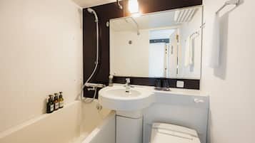Combined shower/tub, free toiletries, hair dryer, slippers