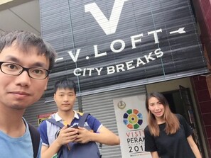 A building with a sign reading "V. LOFT CITY BREAKS". - Vloft Backpackers Hostel (Ipoh)