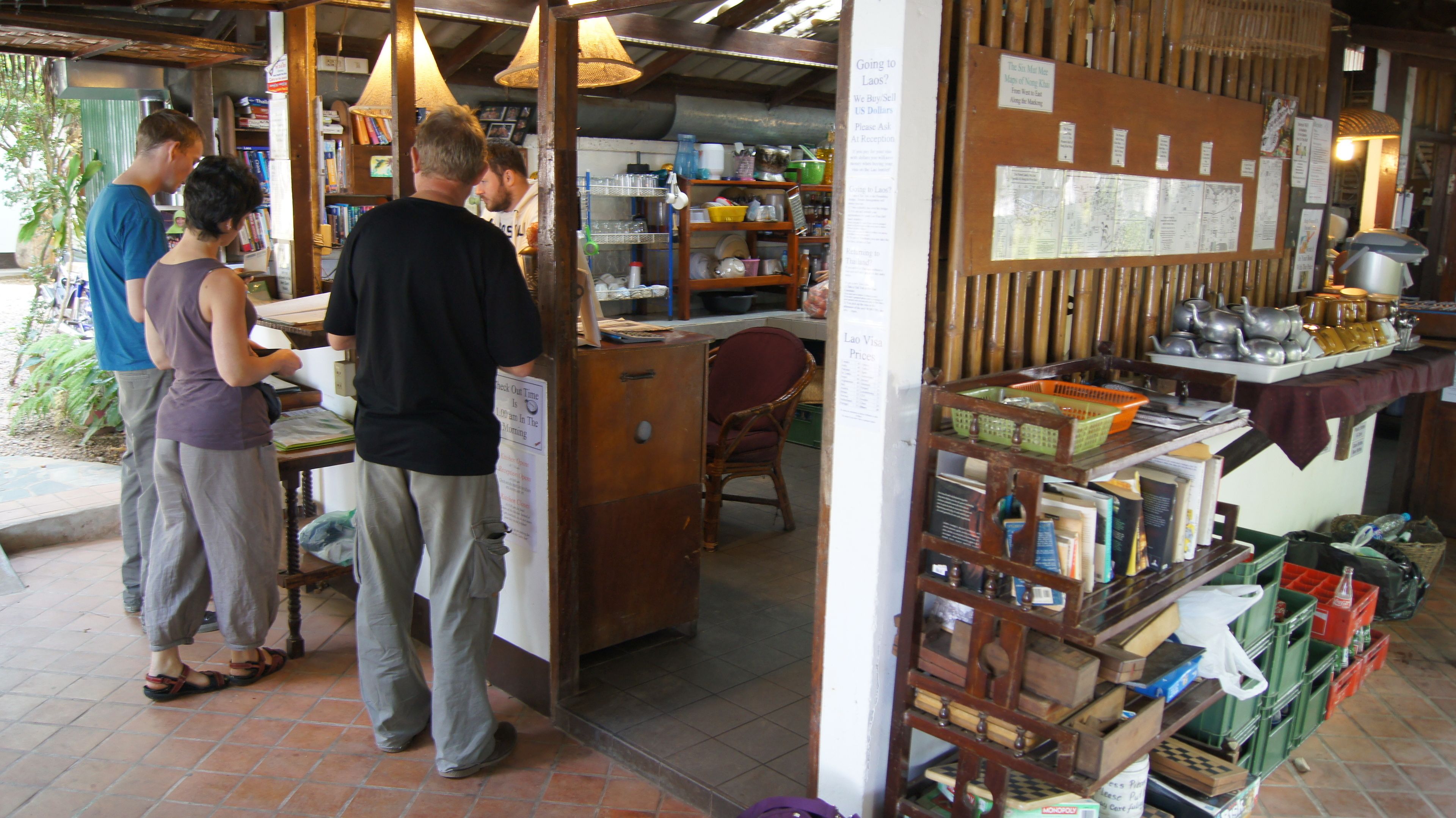 A small, rustic shop with wooden shelves and a variety of items for sale.