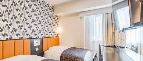 A hotel room with two beds, a patterned wall, a large mirror, and a modern design.