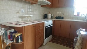 House, Multiple Beds | Private kitchen