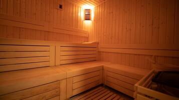 A wooden sauna with benches and a bench seat.
