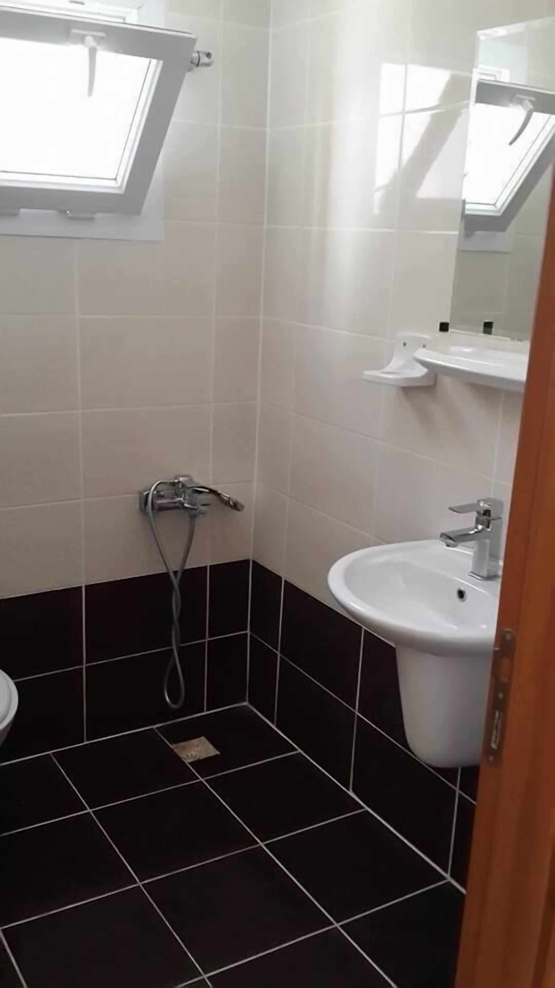 Shower, free toiletries, hair dryer, slippers