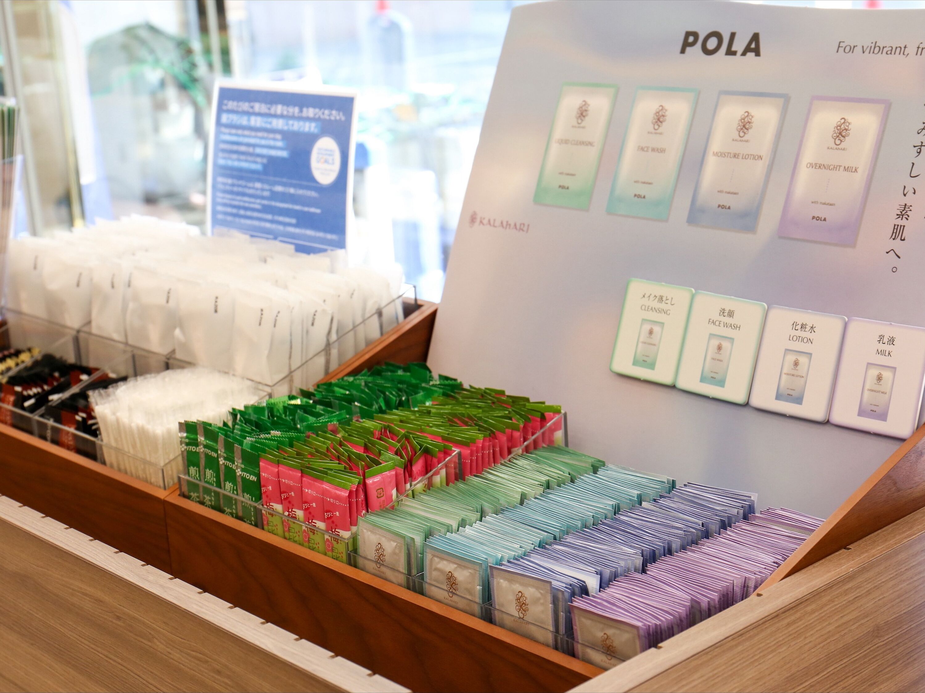 A display of various skincare products including face wash, moisture lotion, and overnight milk.