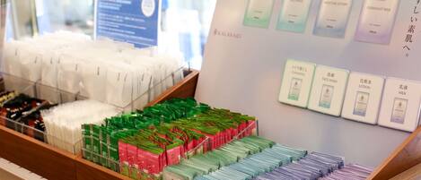 A display of various skincare products including face wash, moisture lotion, and overnight milk.