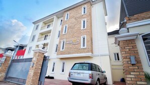A multi-story building with a sign reading "MARCA COURT". - Madiba Court (Lekki)