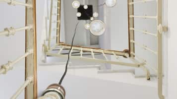 A room with a white ceiling and a visible light fixture.