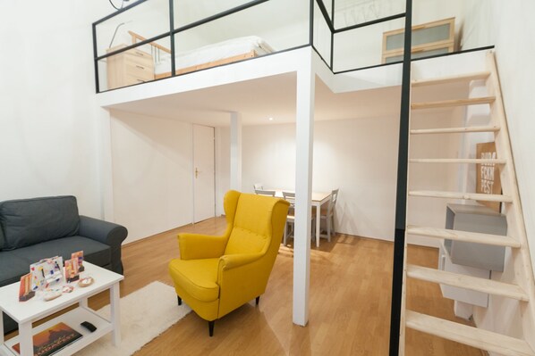 City Studio, 1 King Bed with Sofa bed | Living area | Flat-screen TV