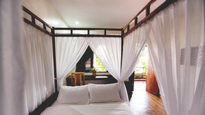 A bed with white linens, a wooden headboard, and sheer white curtains. - House Of My Eternal Love - Kulai Homestay (Kulai)