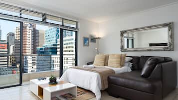 Comfort Condo, Balcony, City View | Living area | Flat-screen TV