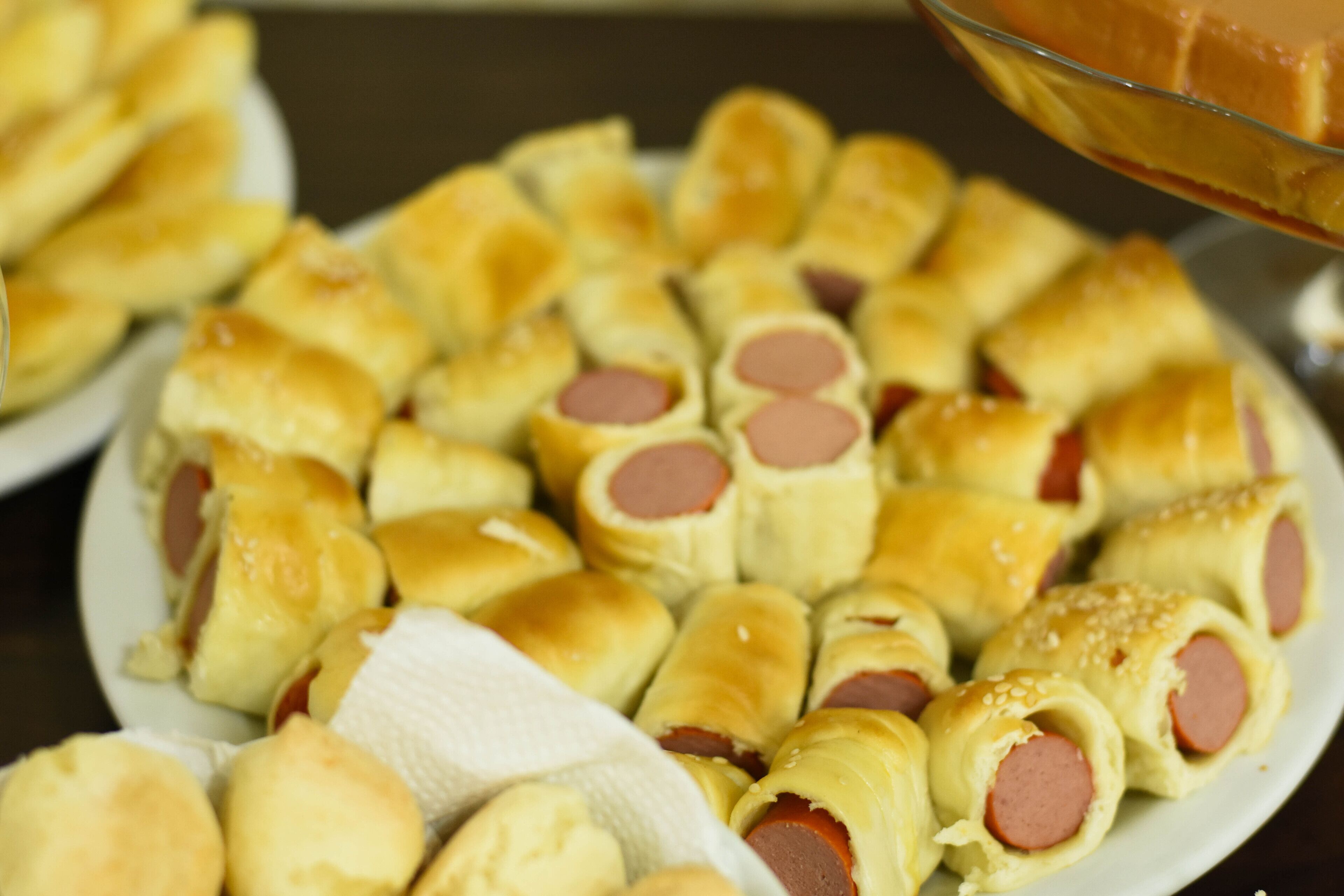 A plate of sausage rolls.