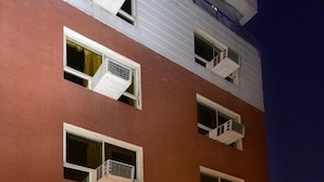 A multi-story hotel with balconies, a reception area, and a sign for 'Hotel Metro'. - Hotel Metro Jiapur (Jaipur)