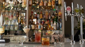 A bar area with a variety of bottles and a selection of drinks on the counter. - The Falcon Hotel & Restaurant (Bridgnorth)
