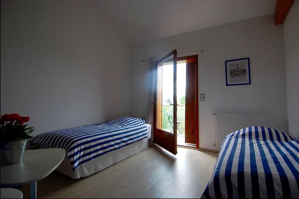 Twin Room (Burlat de Brussieu) | Blackout drapes, iron/ironing board, free cribs/infant beds, free WiFi