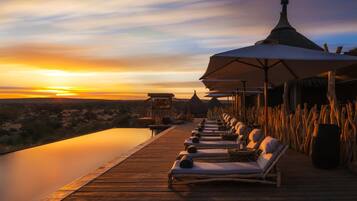 Outdoor pool, pool umbrellas, sun loungers