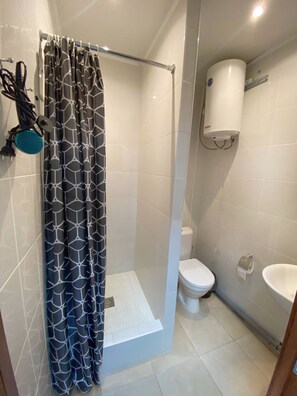 Shower, free toiletries, hair dryer, slippers