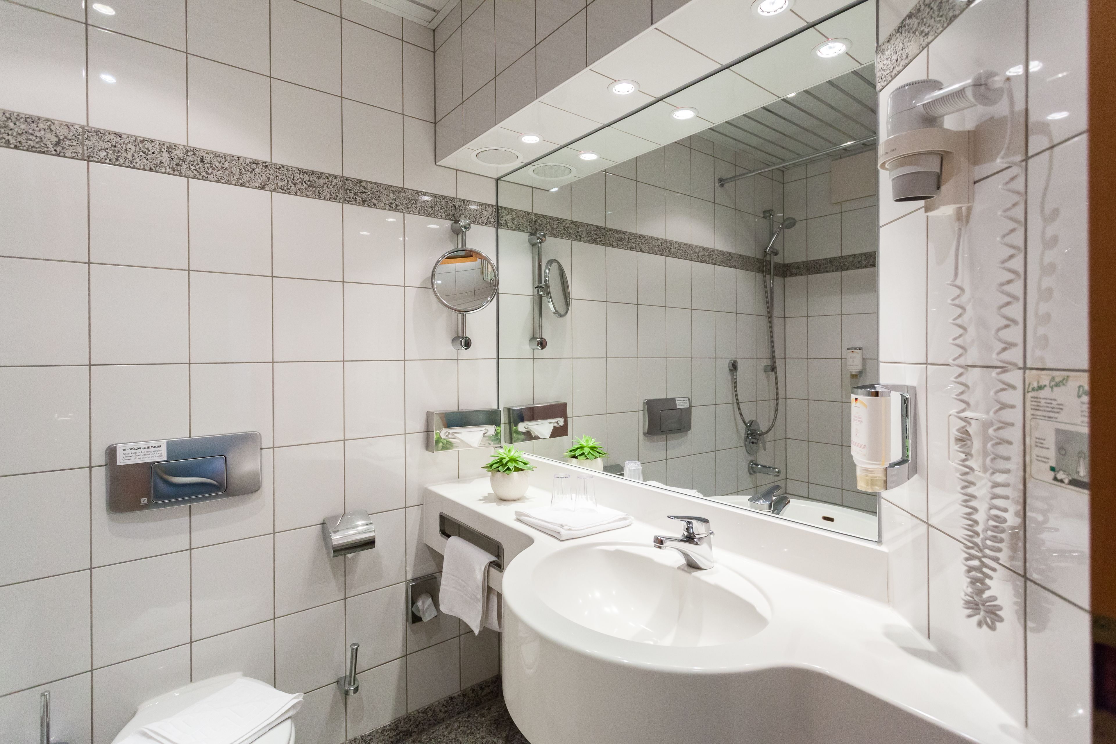 superior double room | bathroom | hair dryer, towels, soap, shampoo
