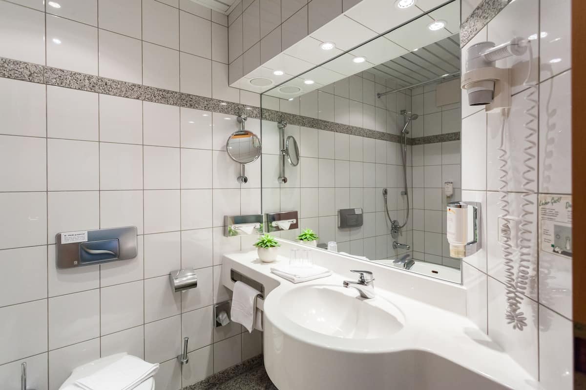 superior double room | bathroom | hair dryer, towels, soap, shampoo