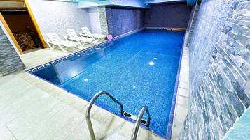 Indoor pool, open 7 AM to 11 PM, sun loungers