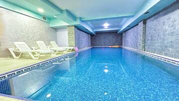 Indoor pool, open 7 AM to 11 PM, pool loungers