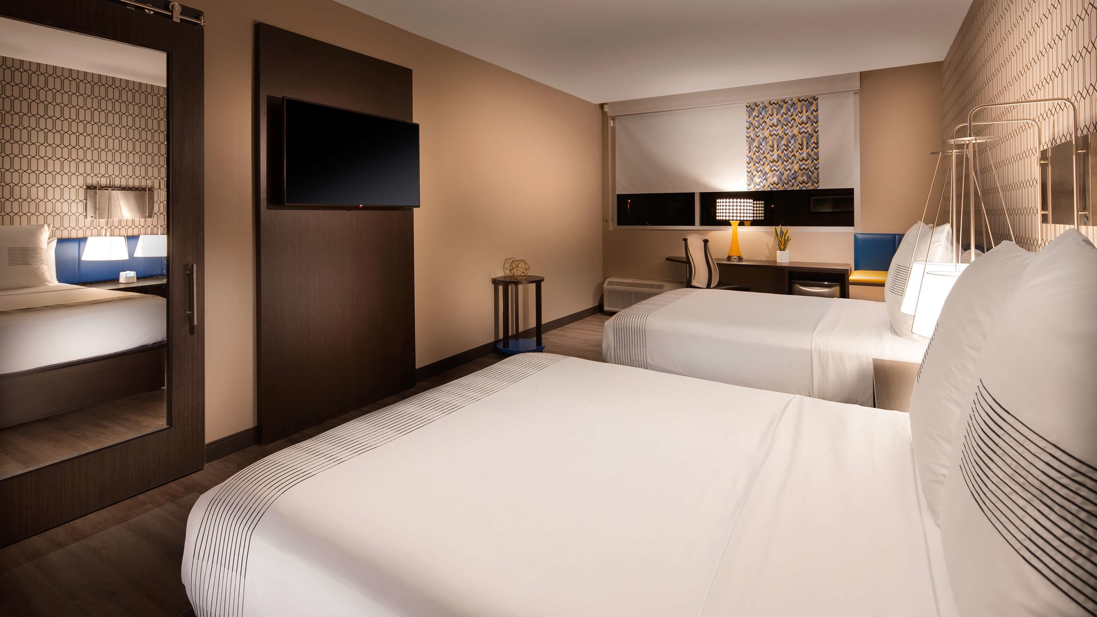 standard room, 2 queen beds, non smoking, refrigerator & microwave | laptop workspace, blackout curtains, iron/ironing board