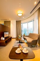 Junior Twin Suite | Living area | 42-inch LCD TV with premium channels, TV