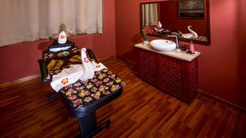 Relax in style with a massage chair and enjoy a refreshing bathroom experience featuring a vanity and mirror.