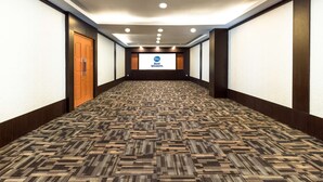 A hotel hallway with patterned carpet, wooden doors, and recessed lighting. - Best Western Senayan (Jakarta)