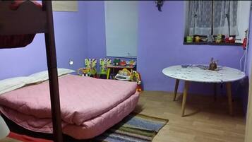 Family Room, Connecting Rooms | Desk, iron/ironing board, bed sheets