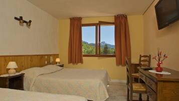 Deluxe Triple Room, Non Smoking, Mountain View | Individually decorated, individually furnished, desk, iron/ironing board
