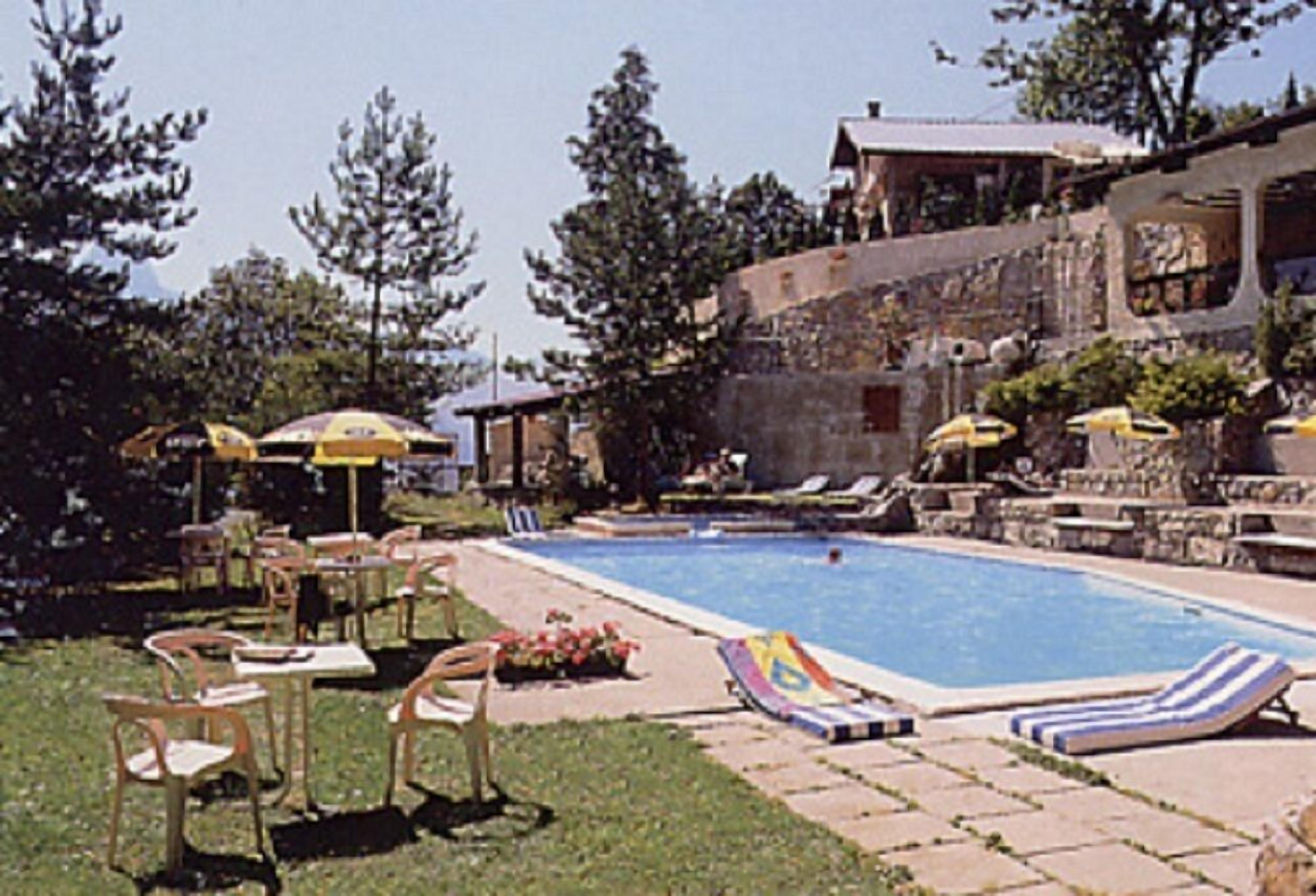 seasonal outdoor pool, pool umbrellas, pool loungers