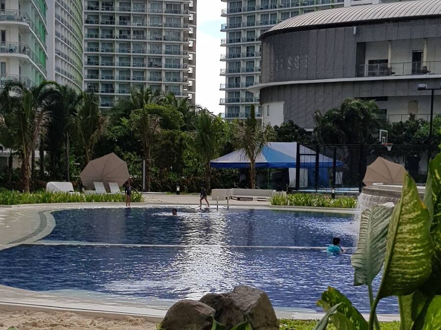 2 outdoor pools, open 7 AM to 7 PM, pool umbrellas