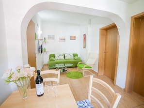 Apartment, 2 Bedrooms, Balcony | Living area | Flat-screen TV