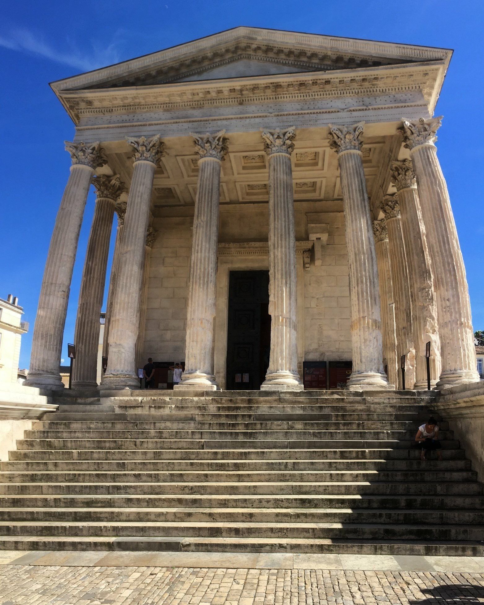 A classical building with large columns and a grand entrance.