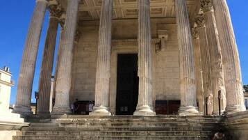 A classical building with large columns and a grand entrance.