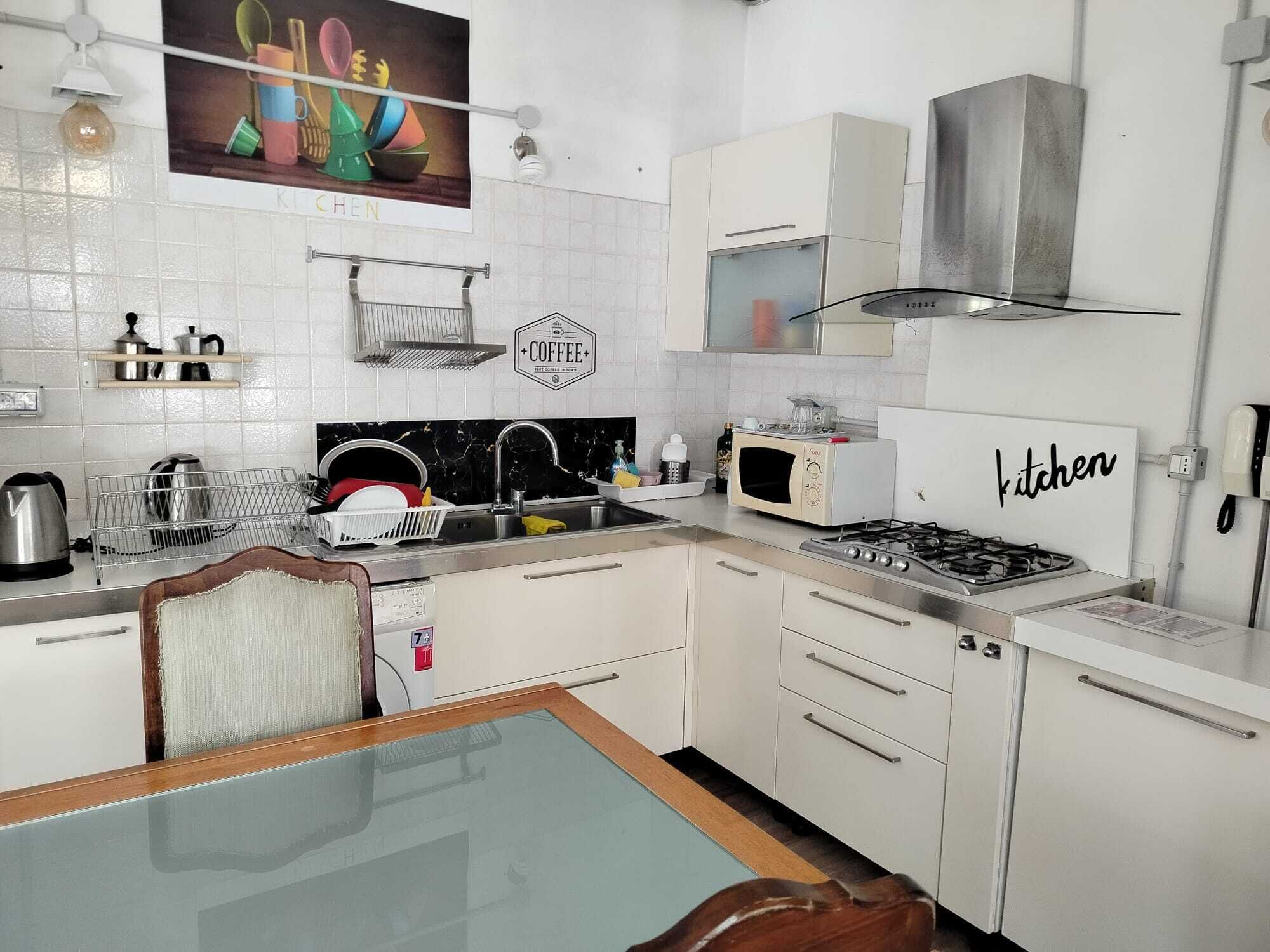 Microwave, stovetop, freezer, dining tables