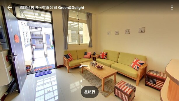 A living room with a sofa, coffee table, and decorative pillows. - Star to travel B&B (Hengchun)