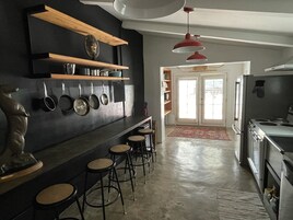 Deluxe Two-Queen Suite - Pets OK | Private kitchen | Fridge, microwave, oven, stovetop